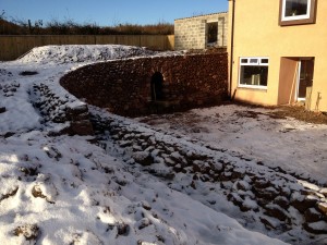 Red sandstone and whinstone retaining wall