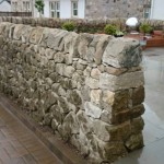 Cope stones on a dry stone wall