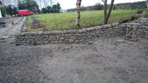 Low dry stone retaining wall