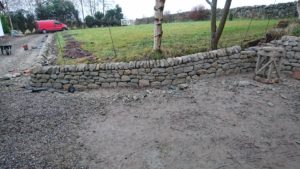 Low dry stone retaining wall