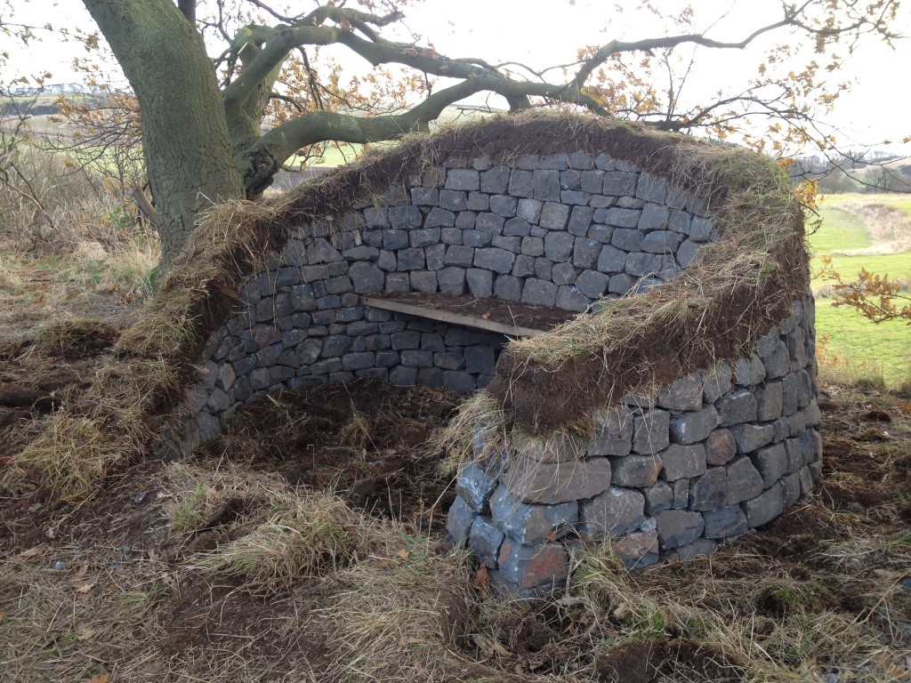 Stone, turf and wood bench