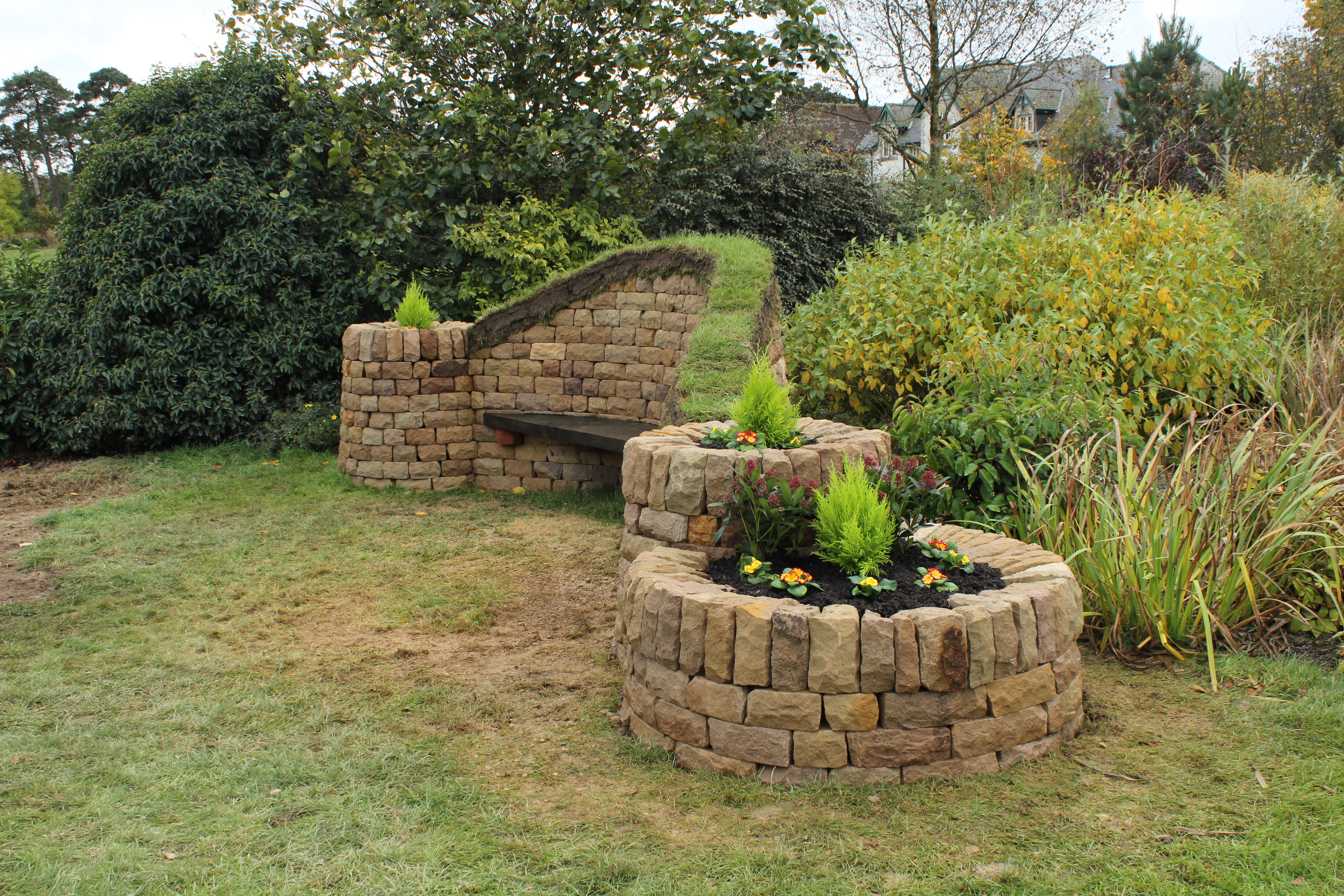Dry stone, wood and turf bench
