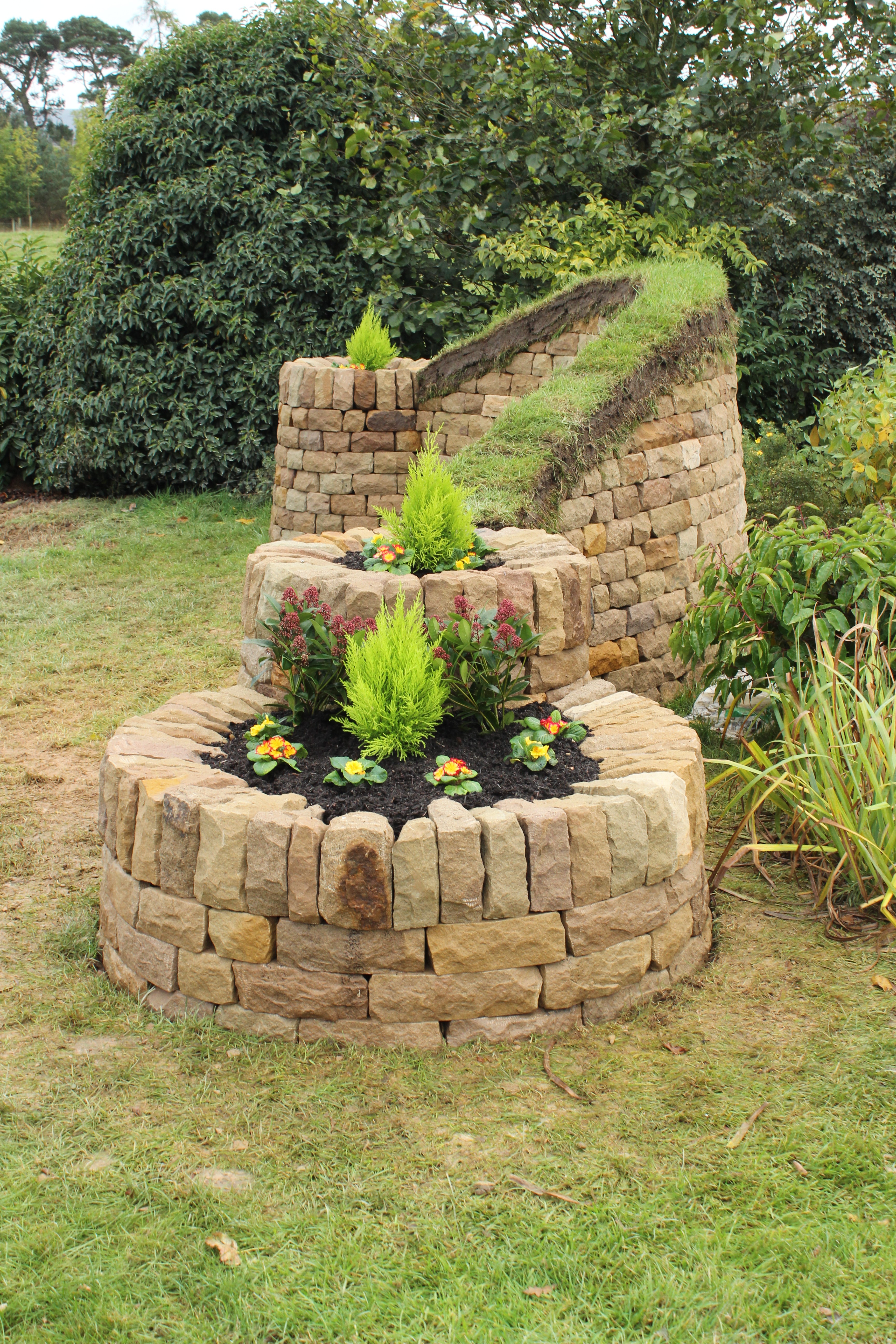 Dry stone, wood and turf bench