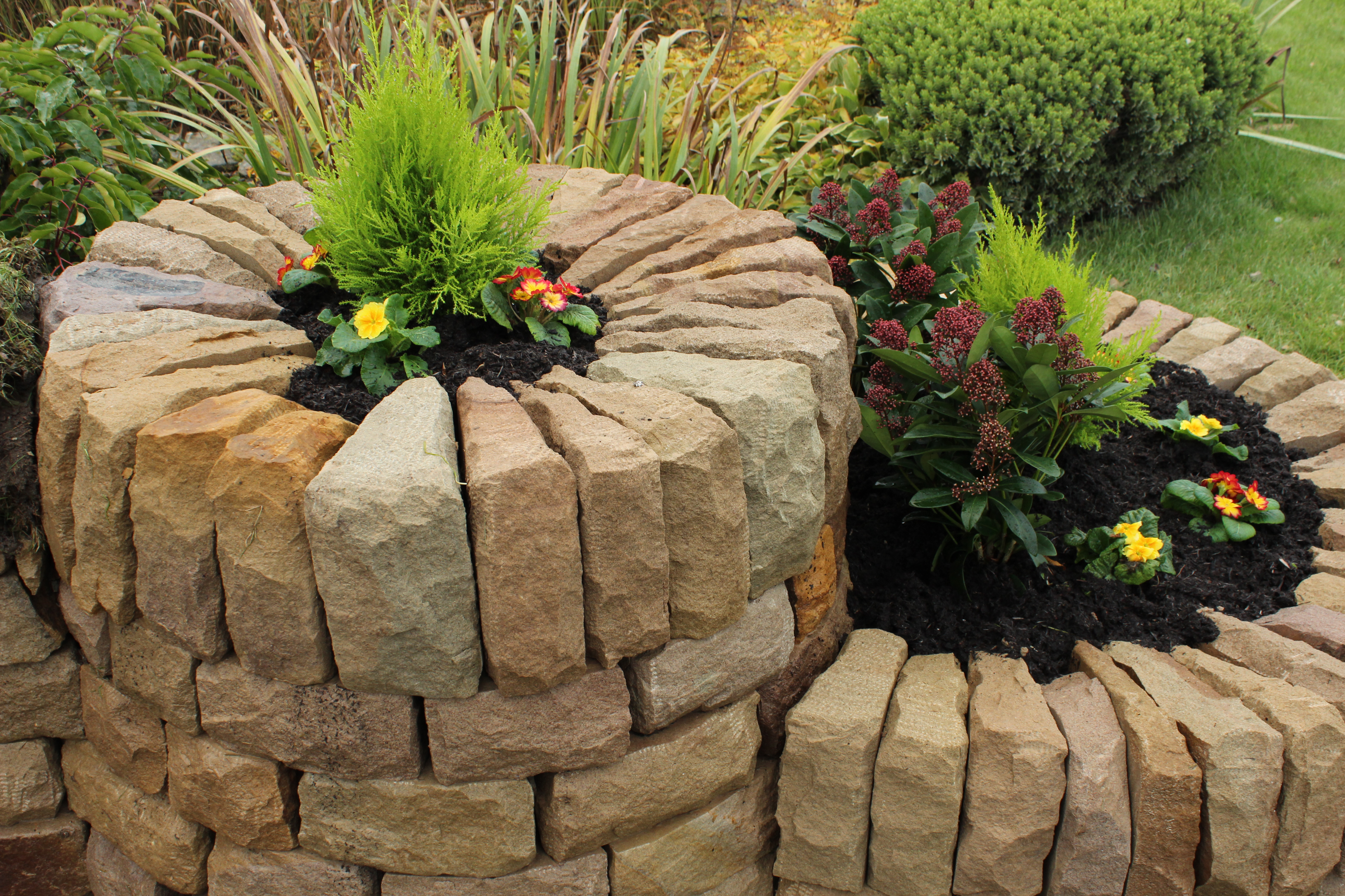 Dry stone, wood and turf bench