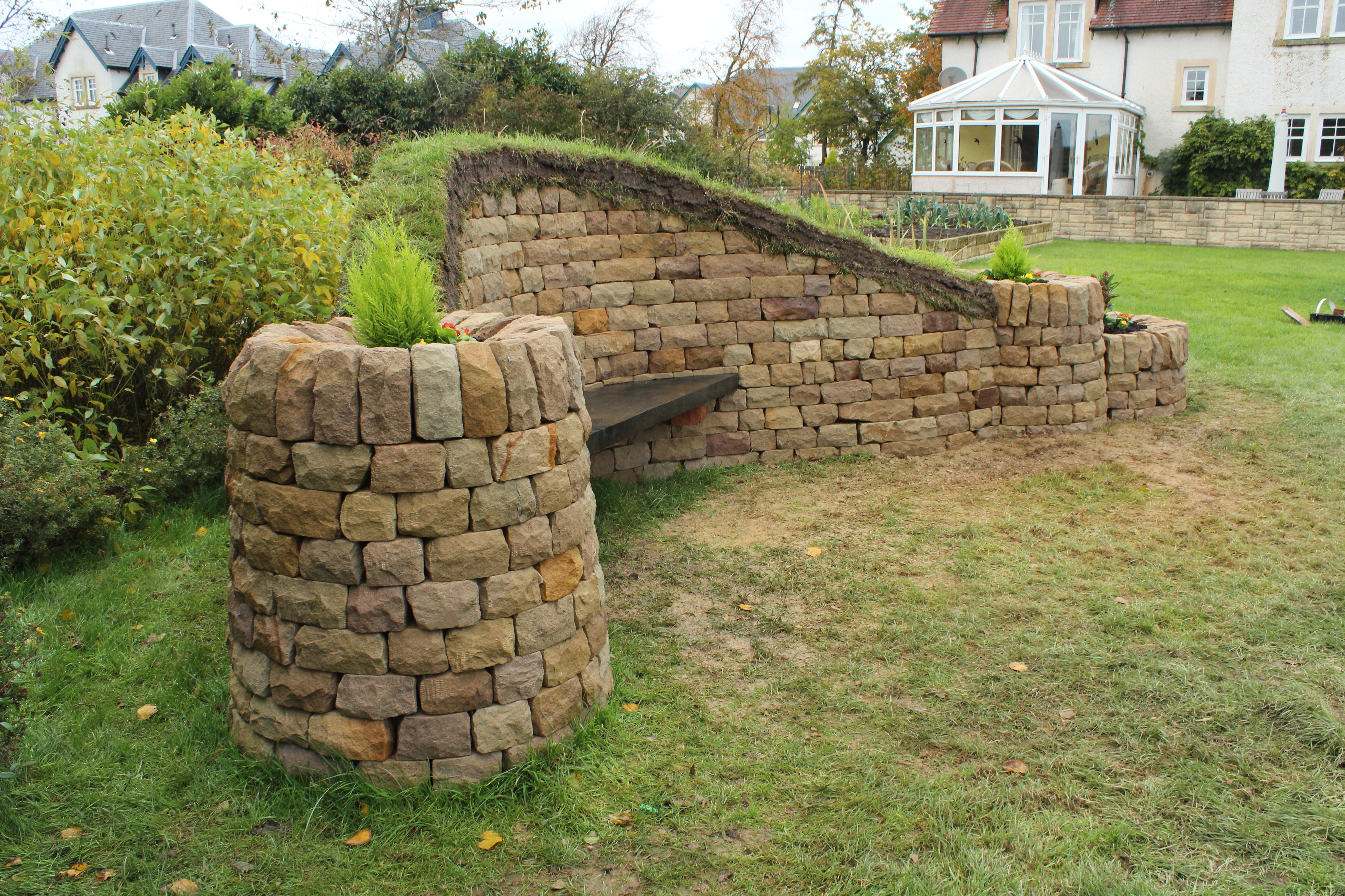 Dry stone, wood and turf bench