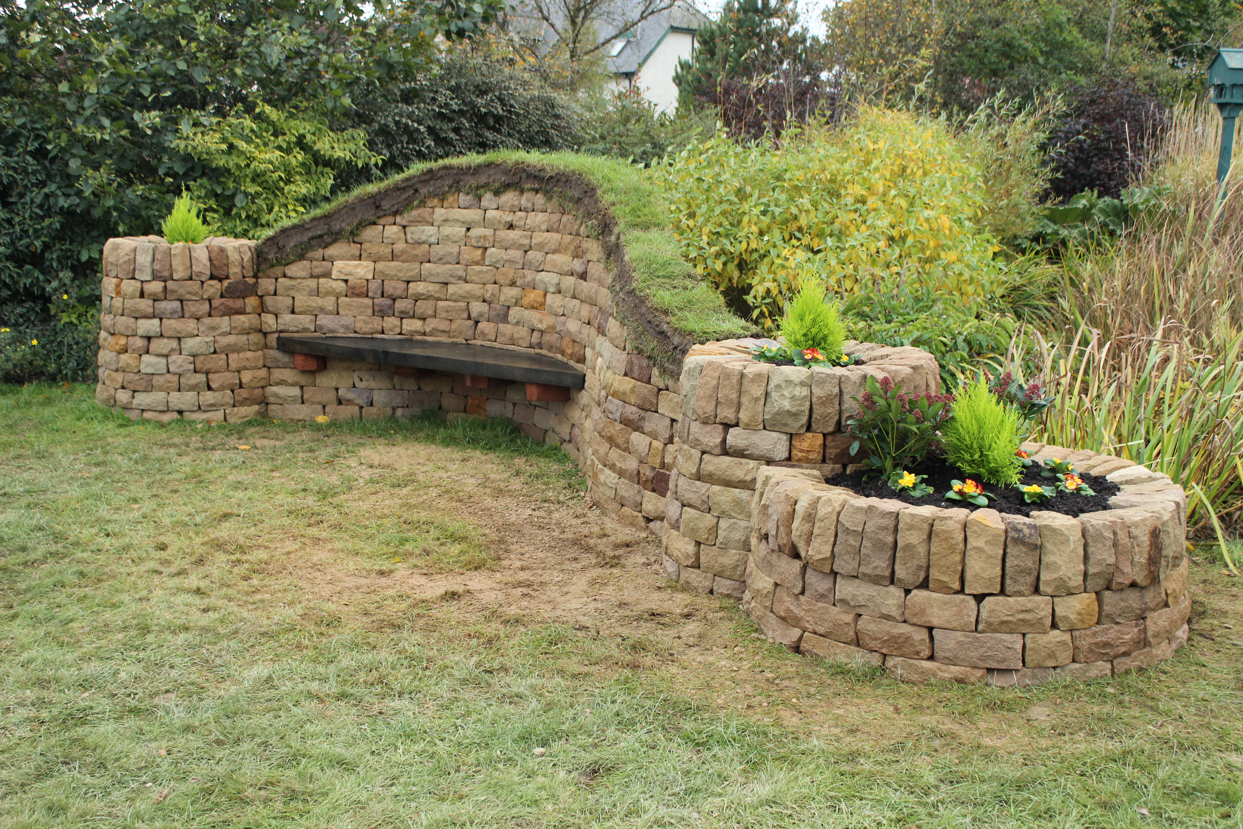 Dry stone, wood and turf bench