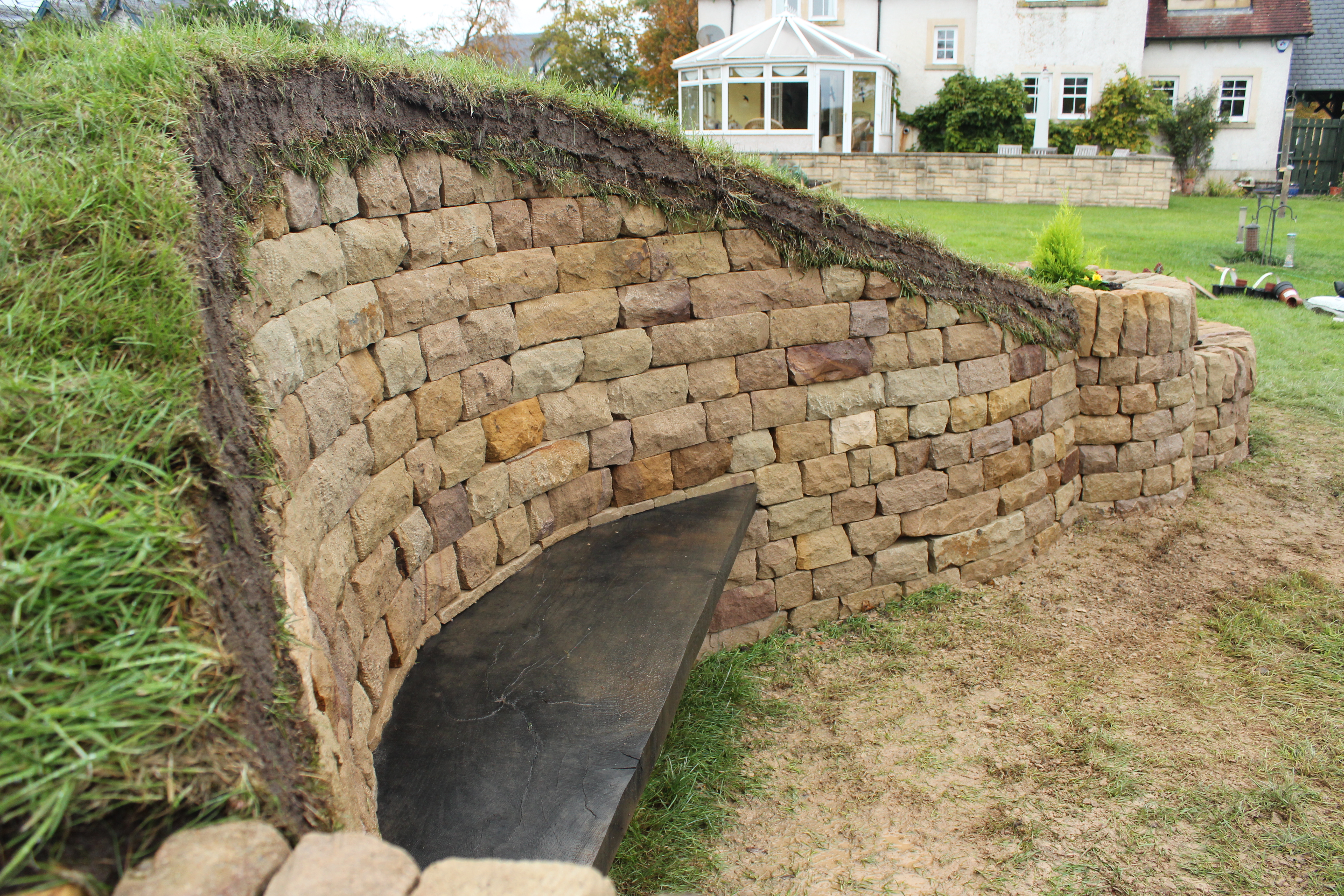 Dry stone, wood and turf bench