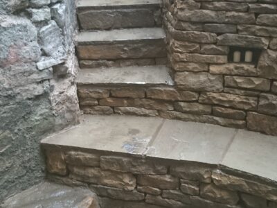 Dry stone retaining wall and steps.