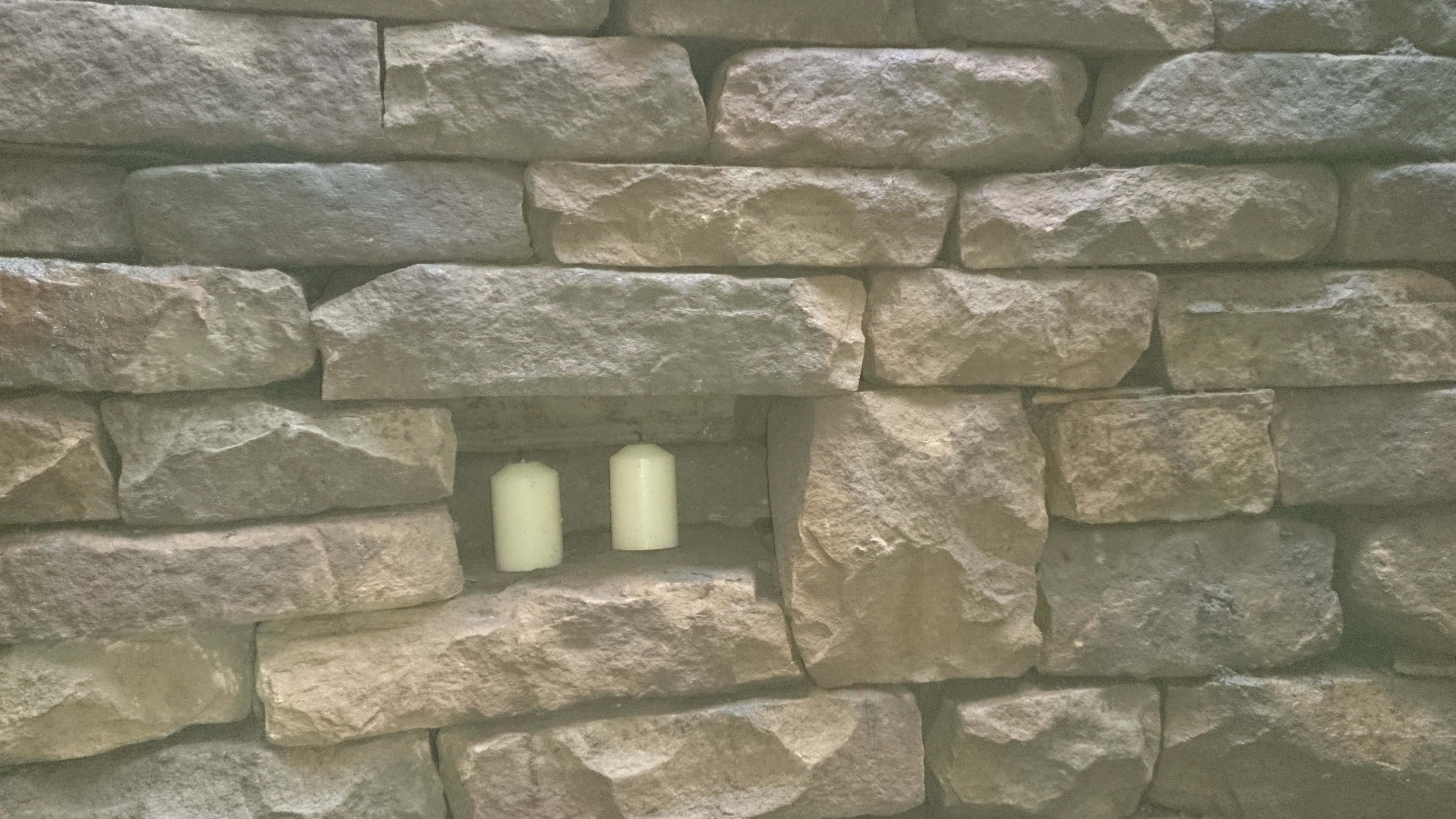 Dry stone retaining wall and candles