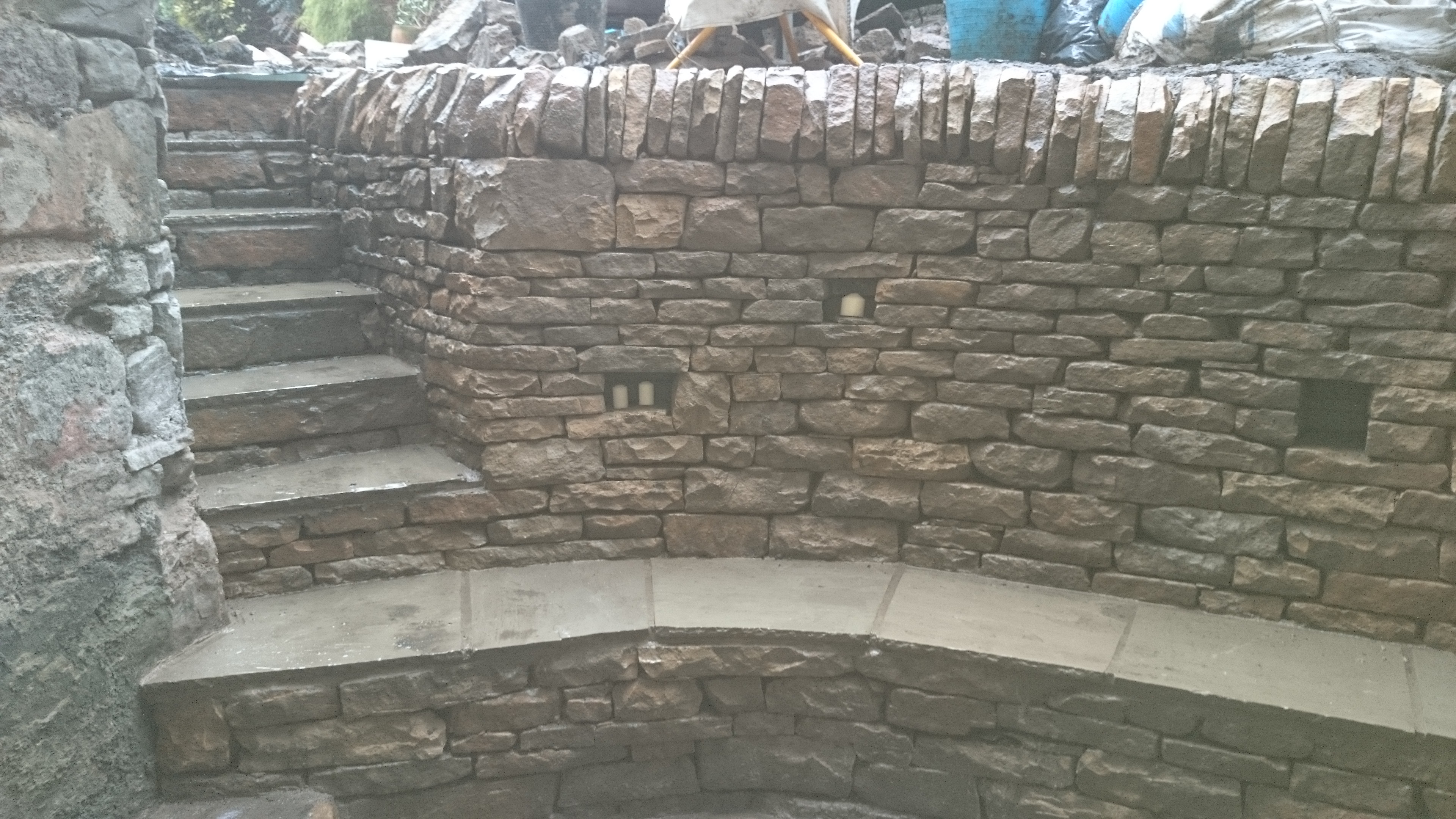 Dry stone retaining wall and bench.