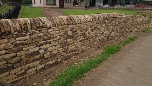Cope stones on a dry stone wall