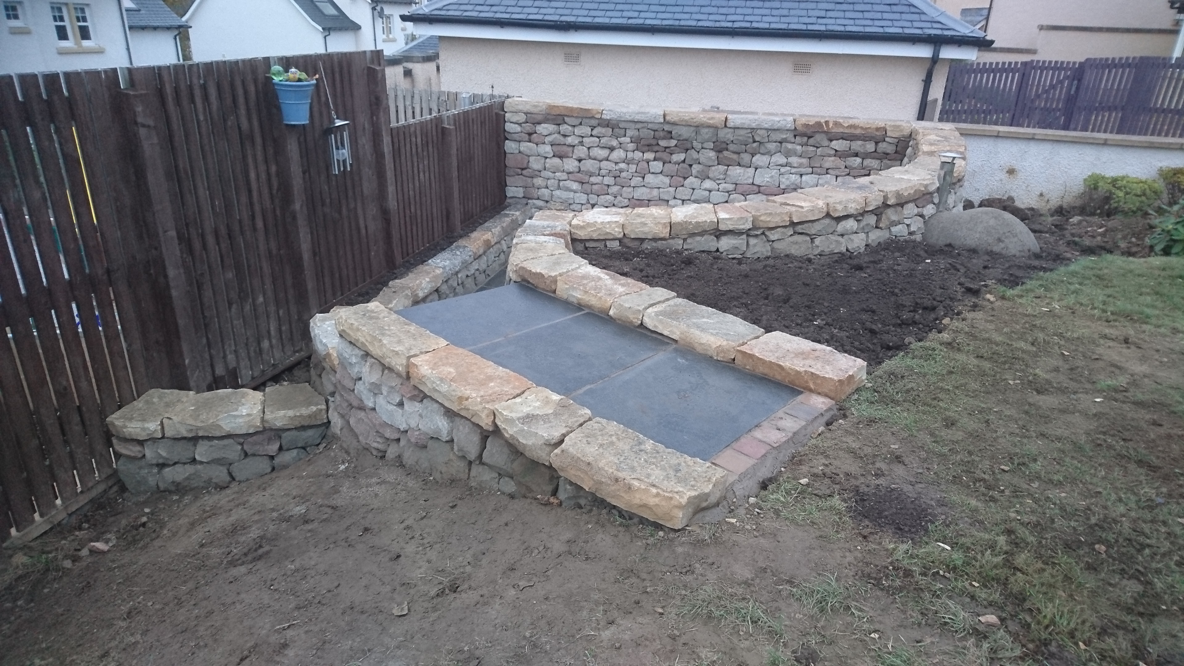 Dry stone seating space and pizza oven