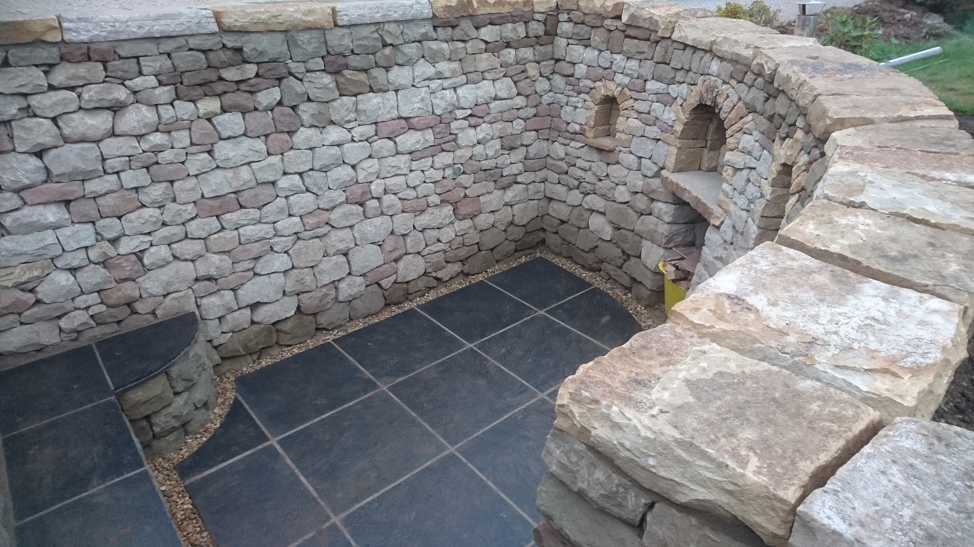Dry stone seating space and pizza oven