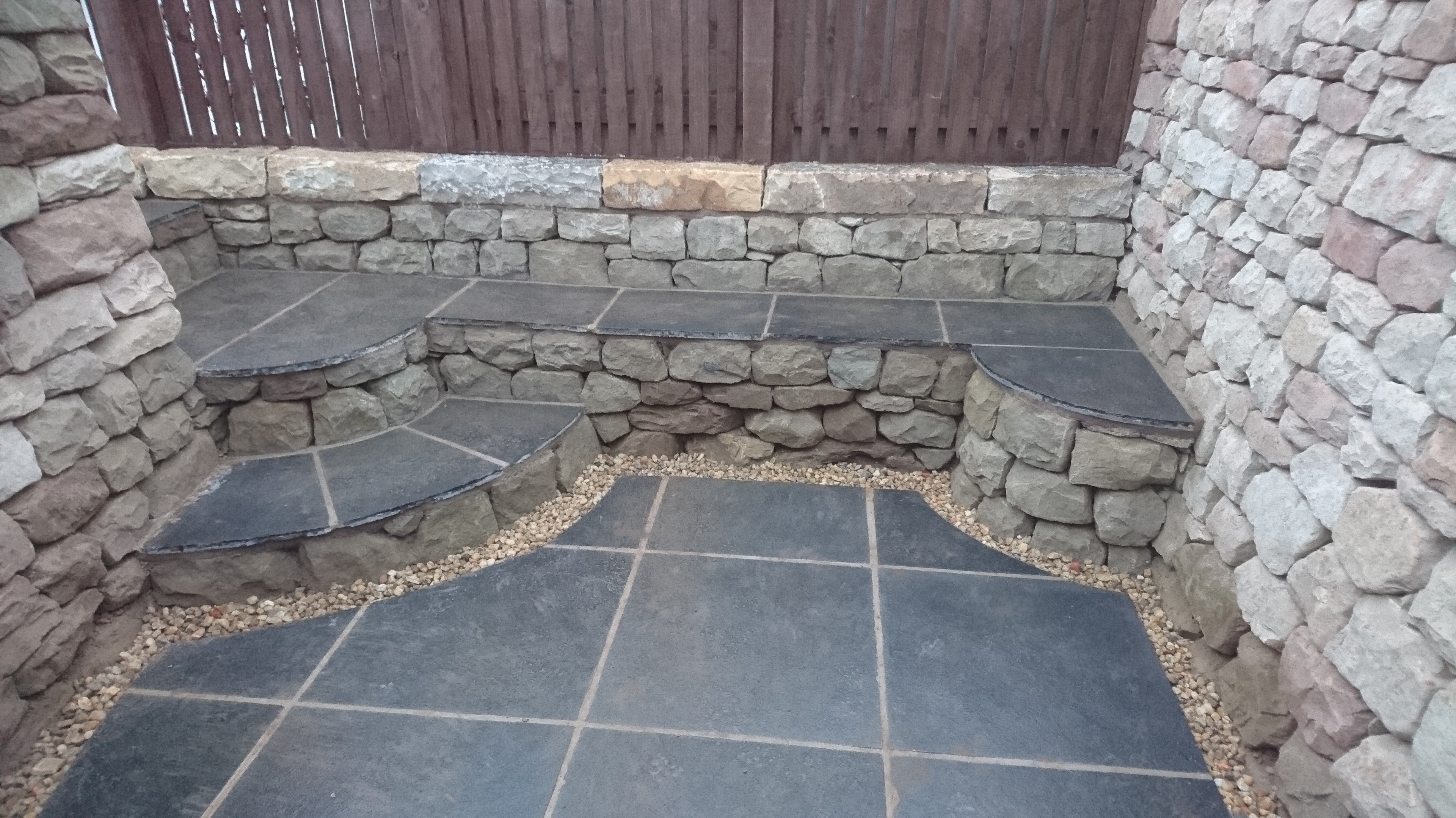 Dry stone seating space and pizza oven