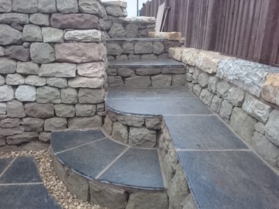 Dry stone seating space and pizza oven