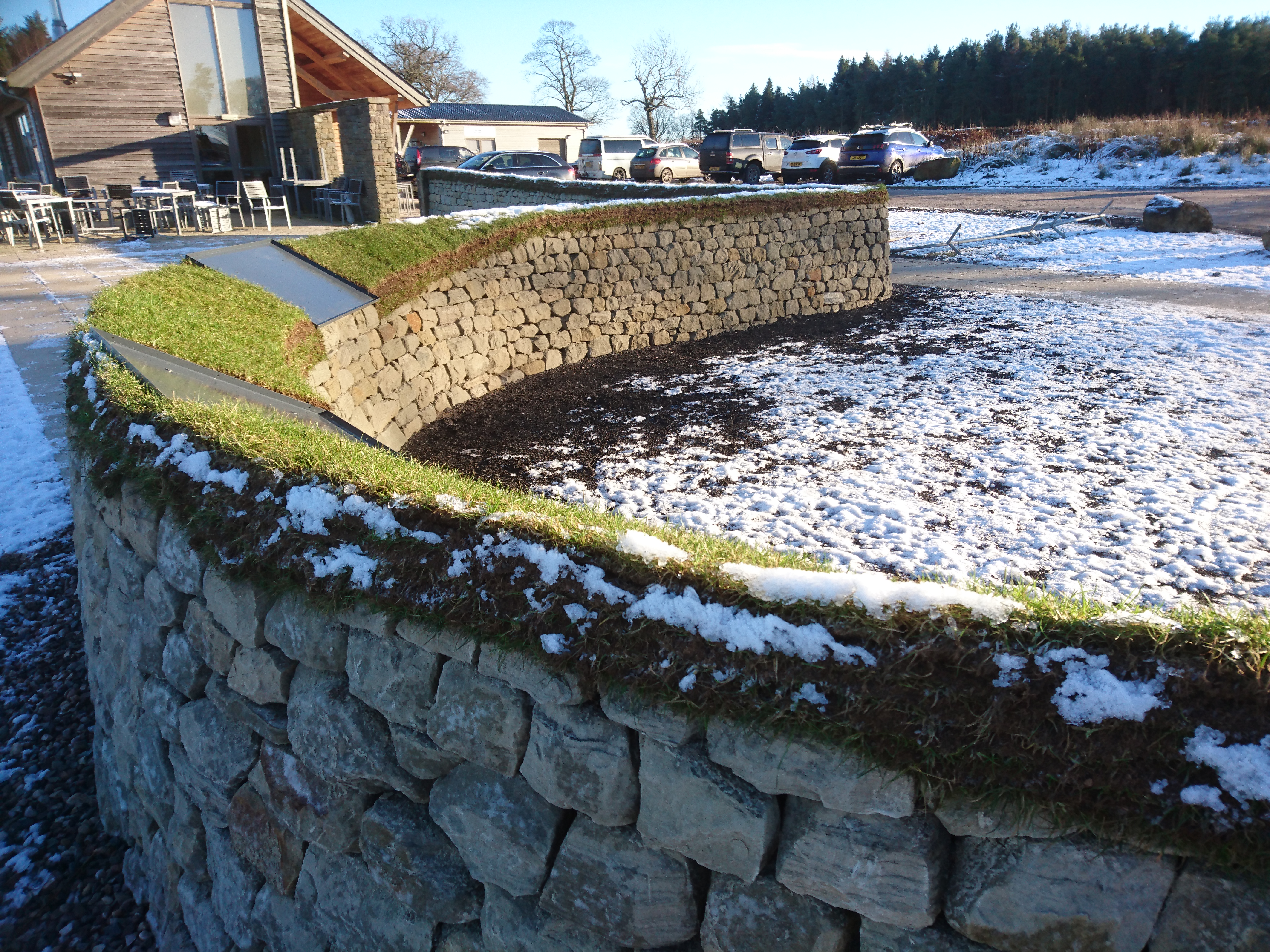 Curved turf topped dry stone wall