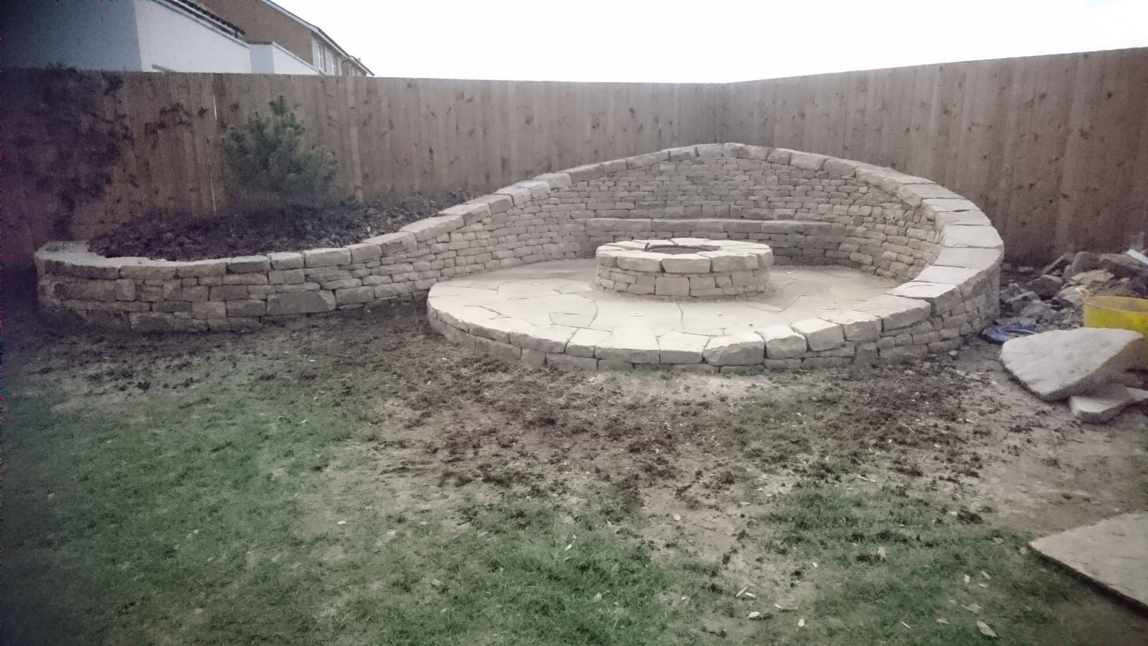 Dry stone bench and firepit