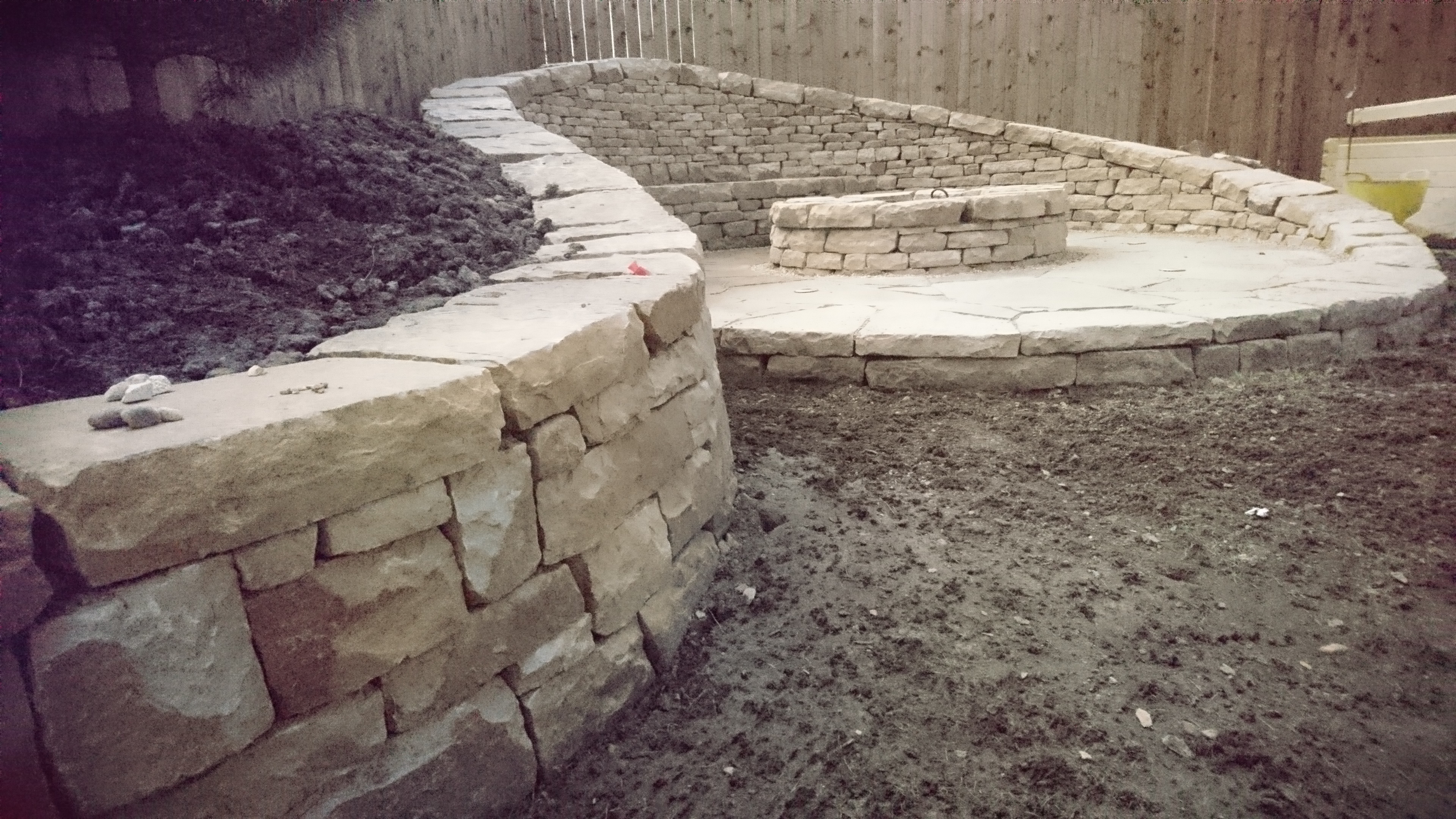 Dry stone bench and firepit