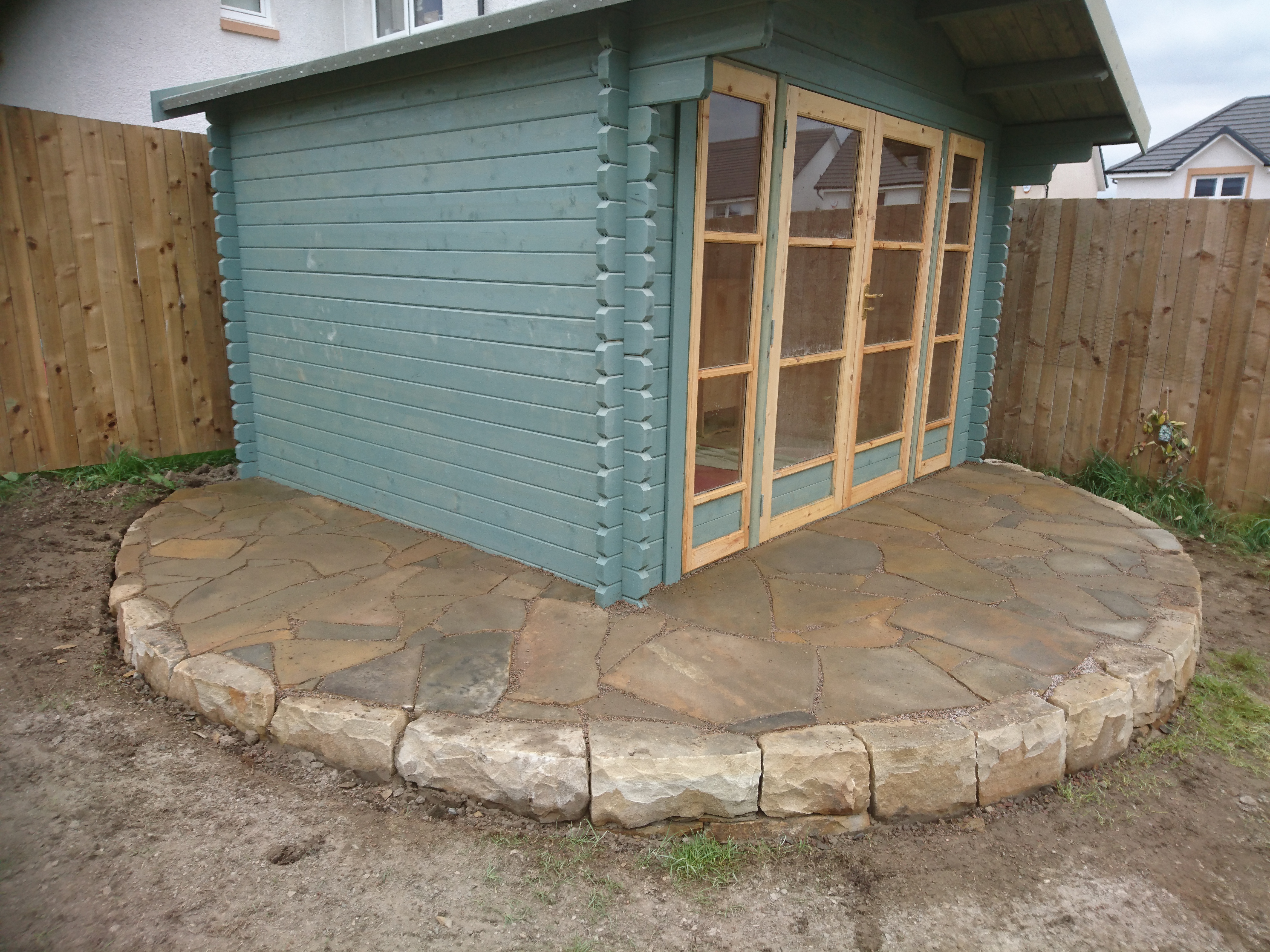 stone base for shed with crazy paving