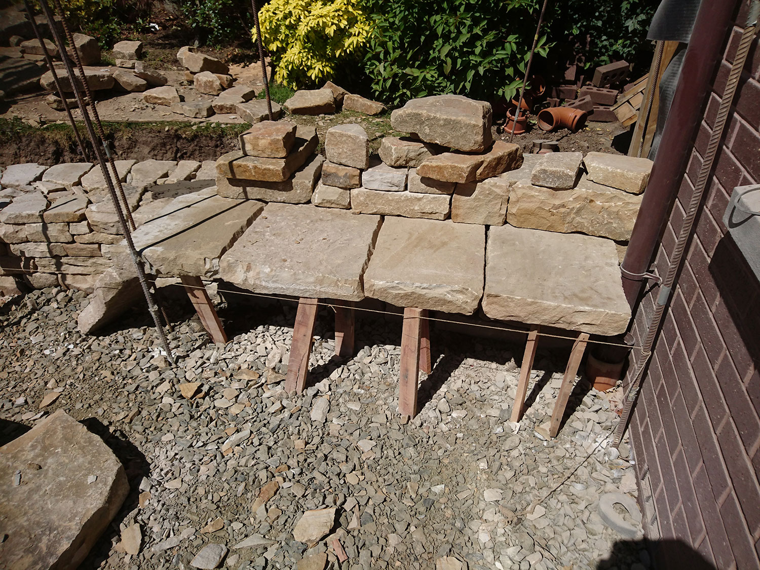 Putting together the large stones for the bench