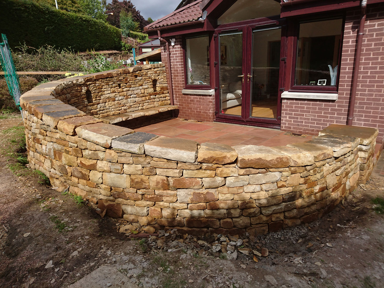 Dry stone bench and paving