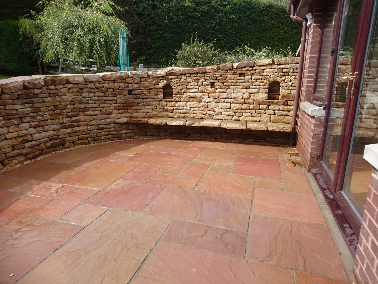 Dry stone bench and paving