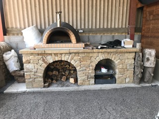 Dry stone pizza base with two arches