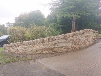 Curved drystone Entrance wall
