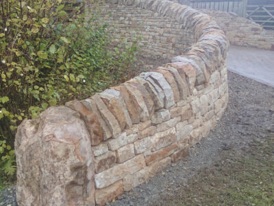 Curved drystone Entrance wall