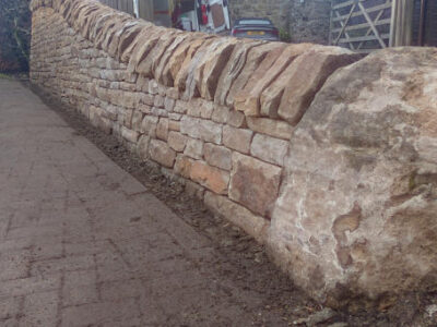 Big boulder and dry stone wall