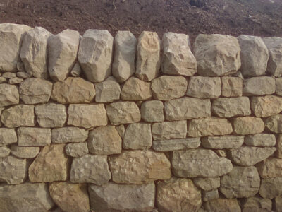 Dry stone retaining wall