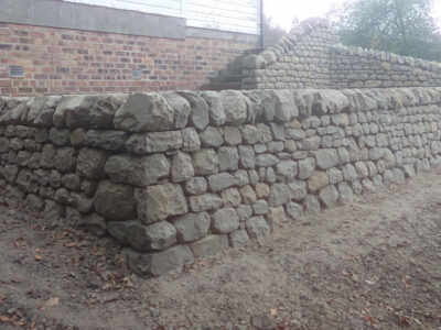 Dry stone retaining wall