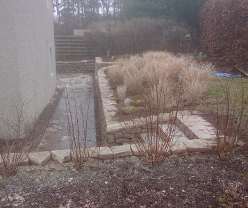 Dry stone retaining wall and steps