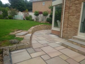 Livingston back garden patio and dry stone retaining wall