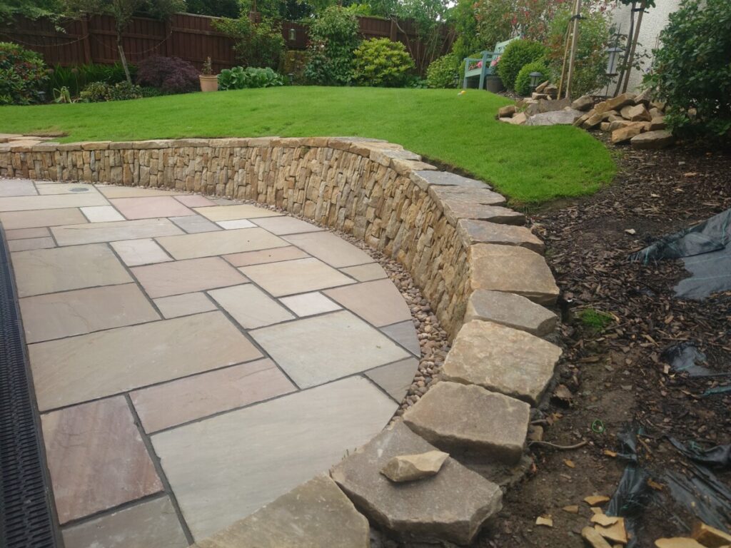 Livingston back garden patio and dry stone retaining wall