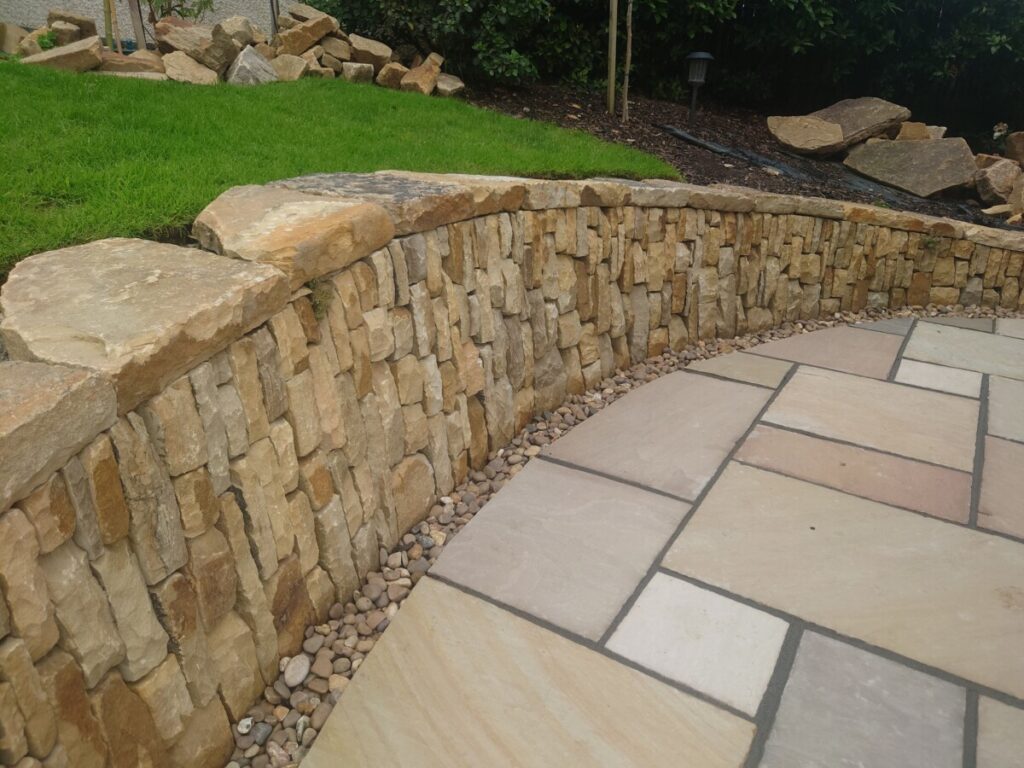 Livingston back garden patio and dry stone retaining wall