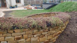 Dry stone bench and fire pit