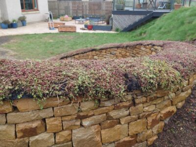 Dry stone bench and fire pit