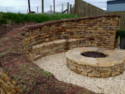 Dry stone bench and fire pit