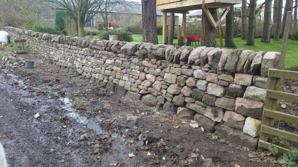 Freestanding dry stone boundary wall