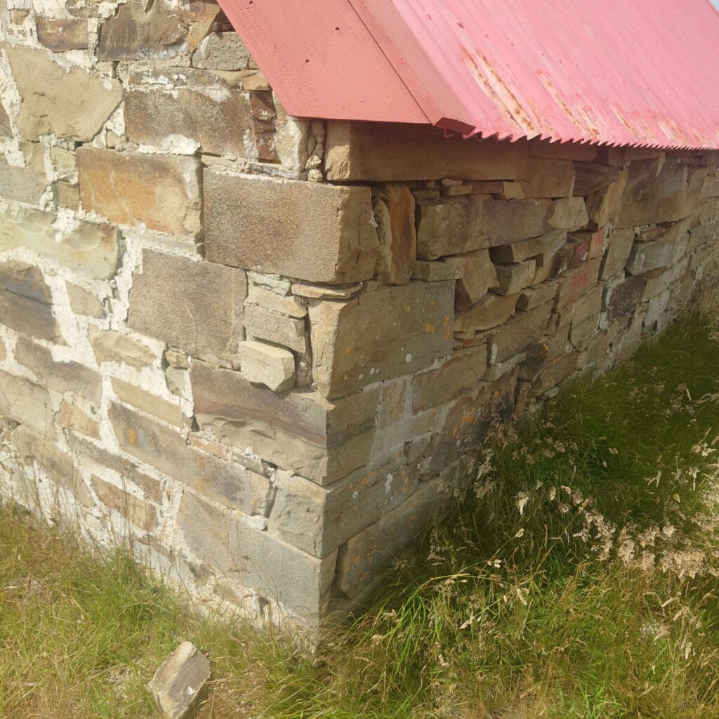 Partial collapse of a stone wall